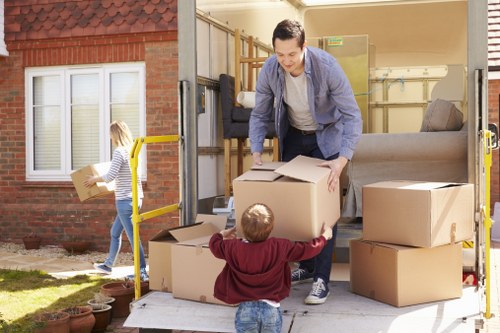Packed moving boxes and furniture for a Brentcross home relocation
