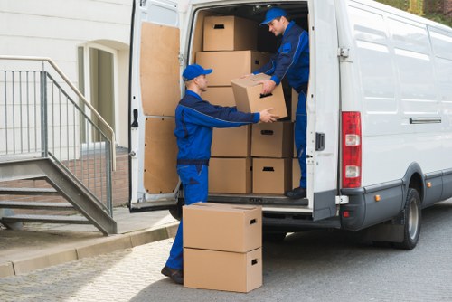 Professional moving truck in Brentcross near local housing and roads