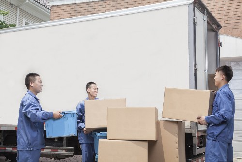 Loading furniture into a removals van near Brentcross