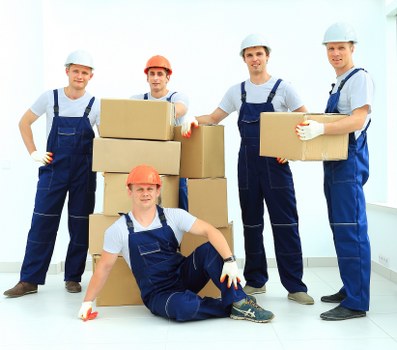 Team preparing moving items safely before loading
