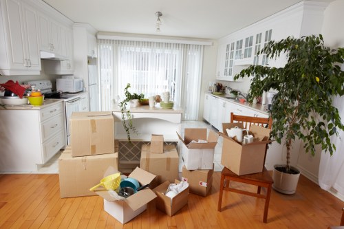 House movers preparing a Brentcross home relocation with boxes and furniture