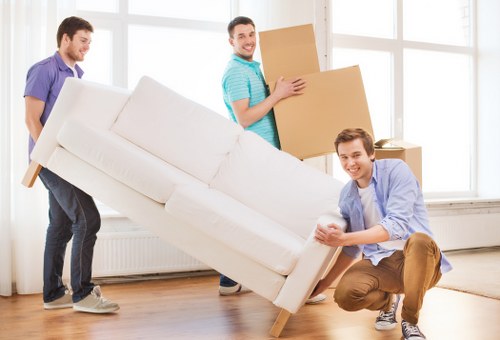 Local moving van loading furniture in Brentcross