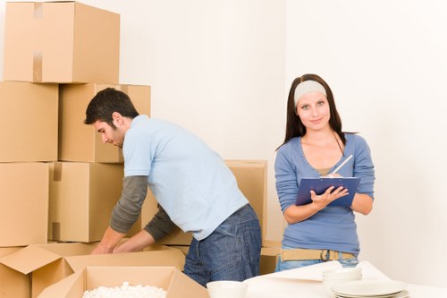 Professional movers handling household furniture on moving day